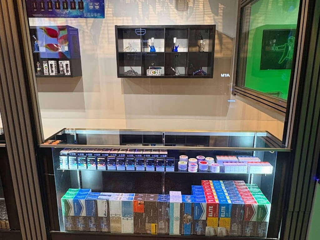 Blaze District cannabis store at 2585 Eglinton Ave W, shelves with products