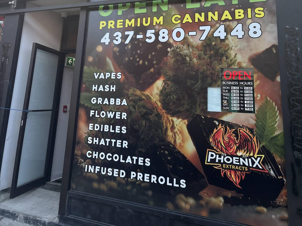 Entrance and outdoor signage at Blaze District on Kensington Ave